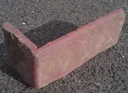 A single thin brick paver L shaped