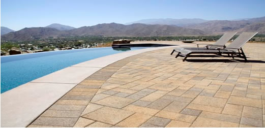 Acker Stone paver deck next to pool.
