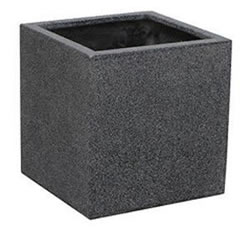 A large cube shaped pot made of terrazzo