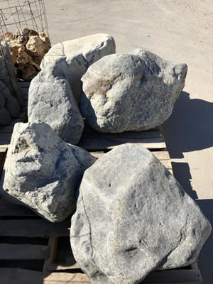 A couple of landscape boulders laying out in the sun