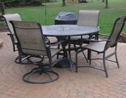 brick paver patio with chairs and table