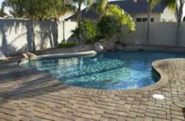 Native Blend thin veneer pavers shown surrounding a beautiful pool.